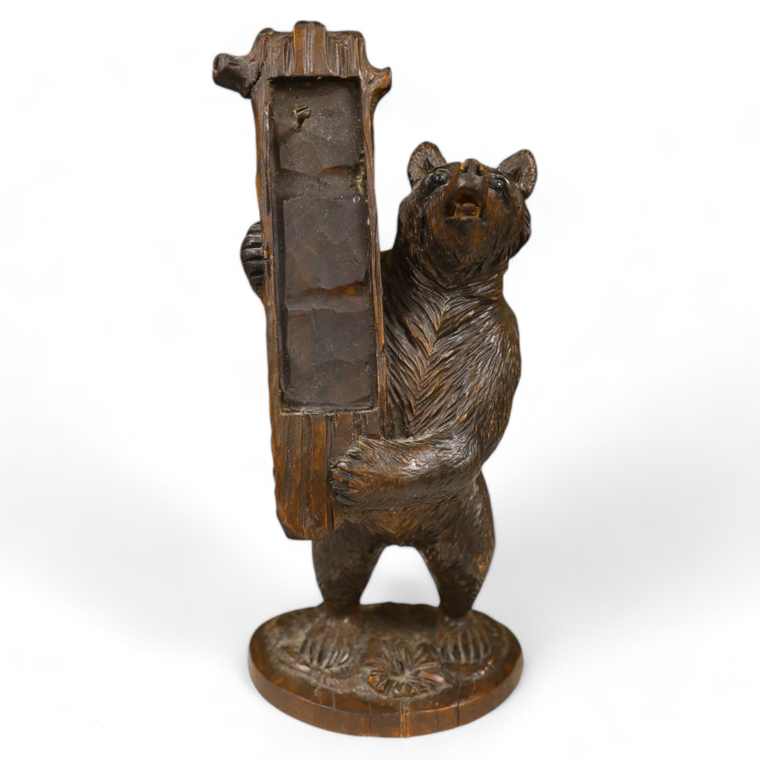 A Black Forest bear stand, 23cm high. Condition - fair needs re waxing